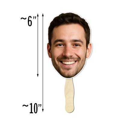 Cardboard cutout of a smiling man's face with dimensions indicated on a white background